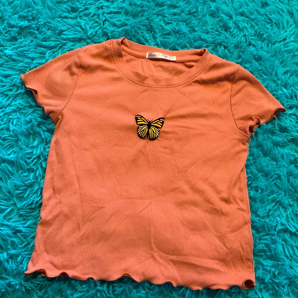 A pink butterfly shirt